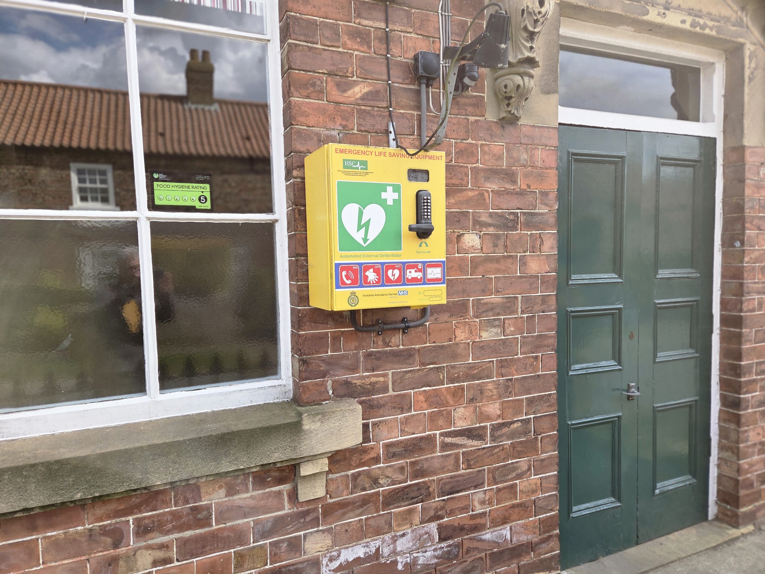defibrillator on front of hall